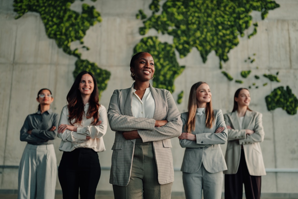 Diverse,Businesswomen,Standing,Together,With,Arms,Crossed,,Representing,Global,Leadership